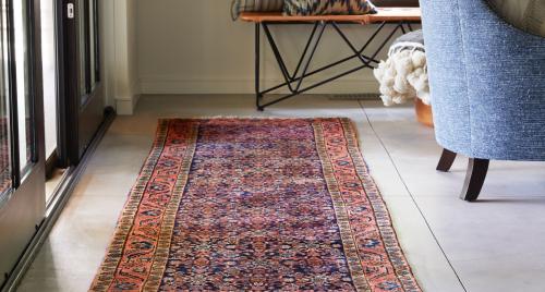 Vintage rug between sliding doors and a chair Vintage rug between sliding doors and a chair