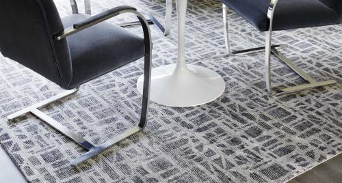 Contemporary-style rug under modern chairs and a table