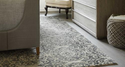 Transitional-style rug under and between furniture Transitional-style rug under and between furniture